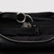 up close of interior key leash of black recycled leather small flat crescent bag