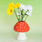 mushroom vase with red top and white polka dots and white stem