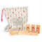 wooden domino set with white dots and dainty red flower print and comes in a red floral grid bag
