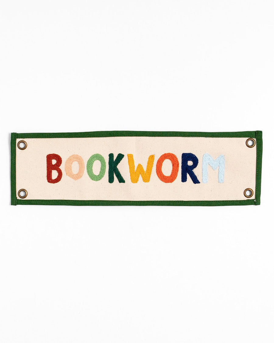 canvas banner with rainbow 'bookworm' across the front and kelly green border