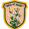 yellow, green and pink embroidered banner with wildflowers and 'wild at heart' across the top