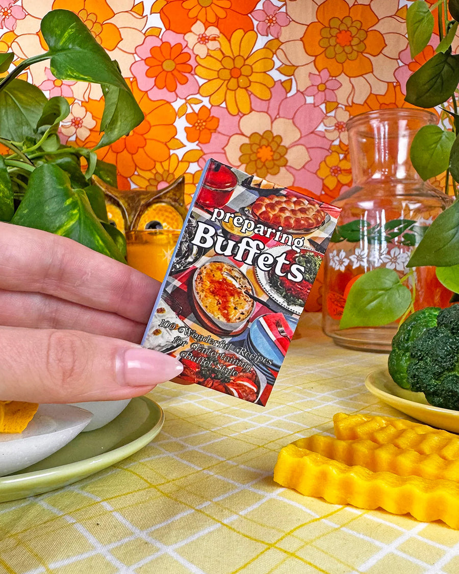 model holding preparing buffet cookbook matchbook