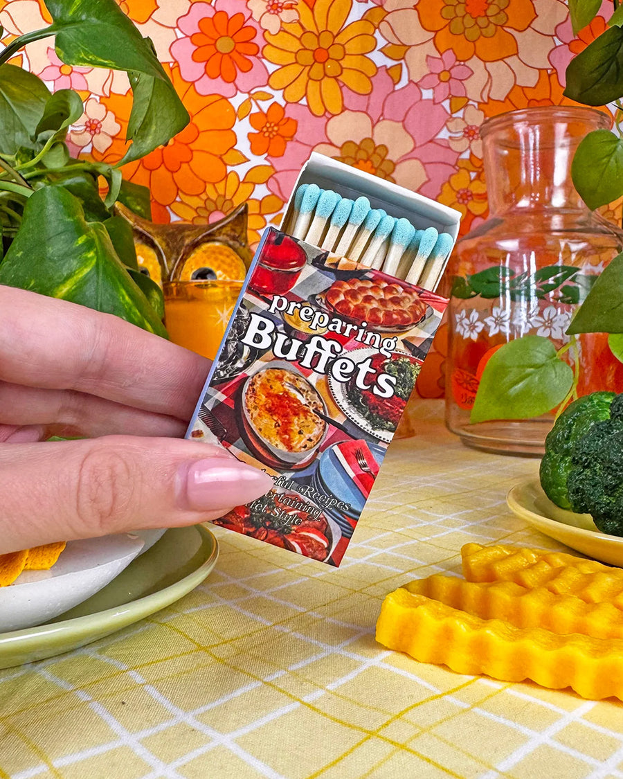 model holding opened preparing buffet cookbook matchbook