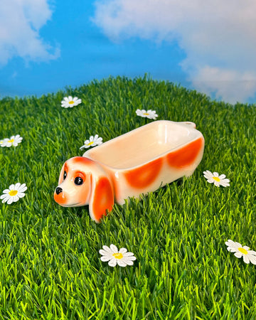 side view of white and brown dachshund dog ceramic tray