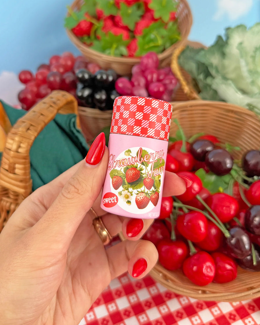 model holding pink strawberry jam red and pink tipped matches