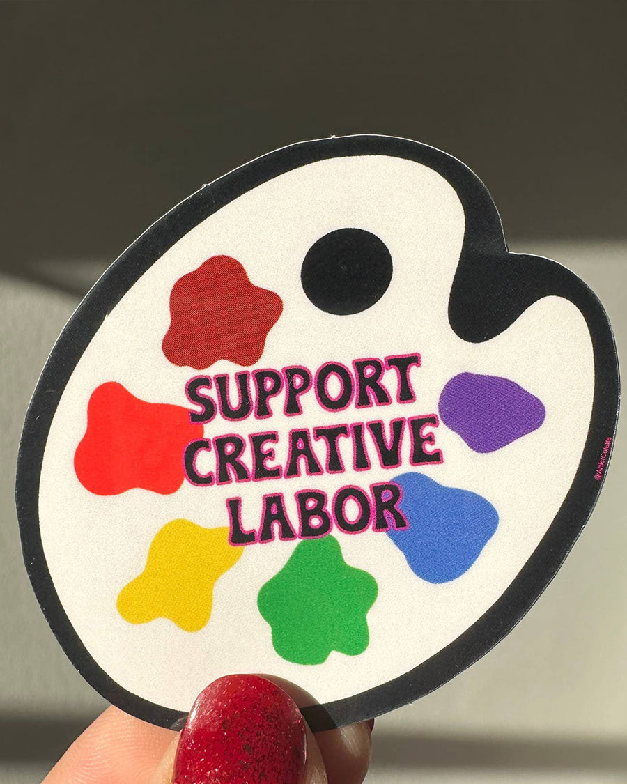 paint palette with the words 'support creative labor' across the front