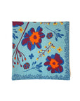 blue cloth napkin with colorful floral print