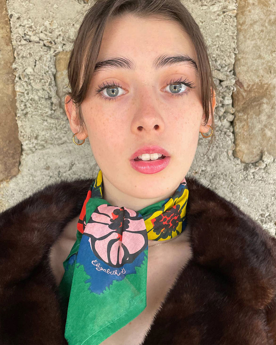 model wearing green kerchief with abstract floral print