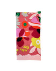 folded pink napkin with colorful abstract floral print