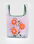clear reusable bag with green trim and 'do good, be good, feel good, have a nice day' across the front with orange flowers
