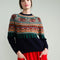 model wearing navy sweater with colorful fair isle print on the top half