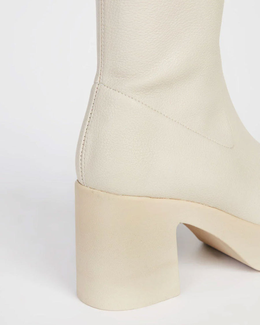 heel on cream platform boots