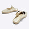 back and front view of cream pearl slip on with mary jane buckle and espadrille soles