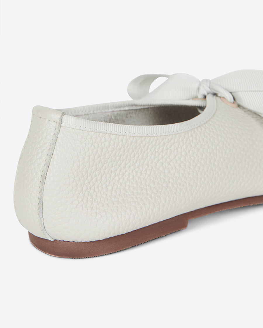 back view of cream ballet shoes inspired flat with pointed toe and tie