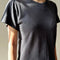 side view of model wearing relaxed fit carbon grey cotton tee