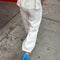 back view of model wearing white cotton balloon pants and matching top