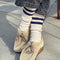 model wearing heather oatmeal crew socks with double navy stripes at the top