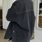 back view of model wearing oversized washed black button down jacket
