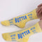 model wearing yellow butter stick crew socks