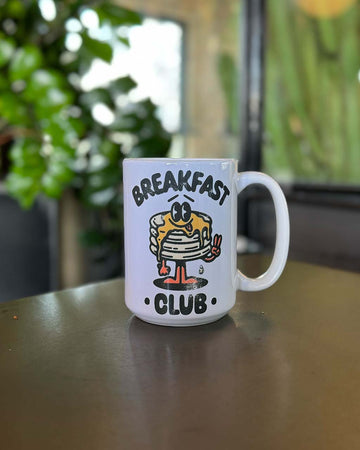 15 oz. white mug with smiley pancake stack and 'breakfast club' typography