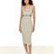 model wearing vertical grey stripe midi dress with button detail on the waist