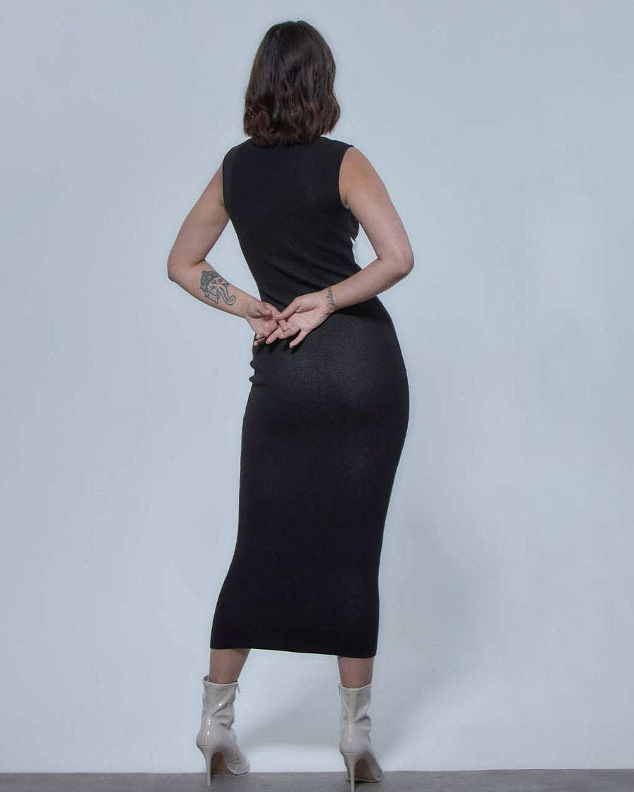back view of model wearing solid black maxi dress