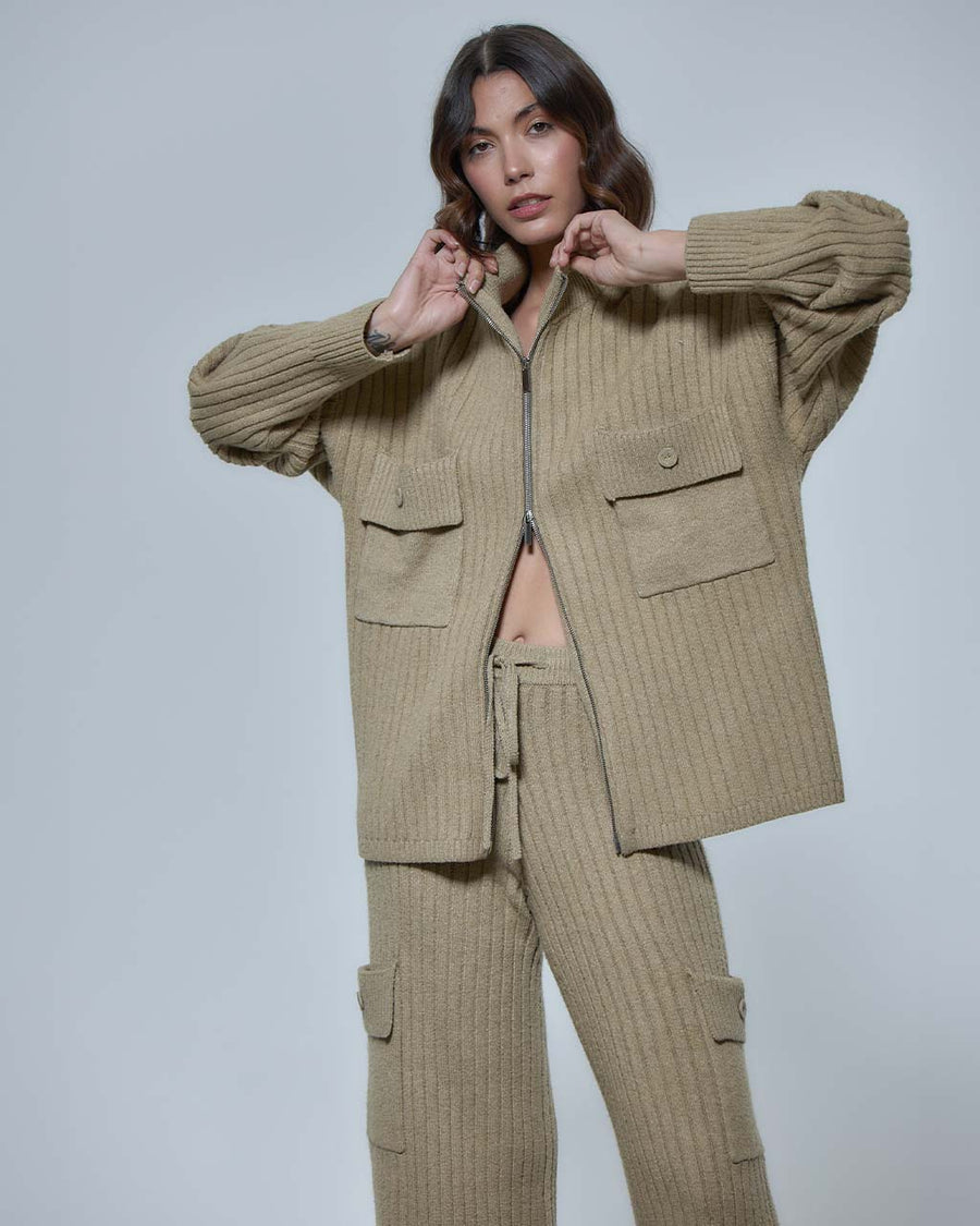 model wearing biscuit double zipper sweater with relaxed fit, ribbed material and oversized patch pockets