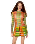 front view of model wearing orange, blue and green plaid sheer top with boat neckline and long sleeves