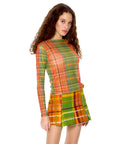 model wearing orange, blue and green plaid sheer top with boat neckline and long sleeves
