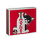 red matchbox with black and white cat hiding behind a glass milk bottle