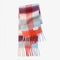 folded thick scarf with various shades of blue  and red checkers and fringe