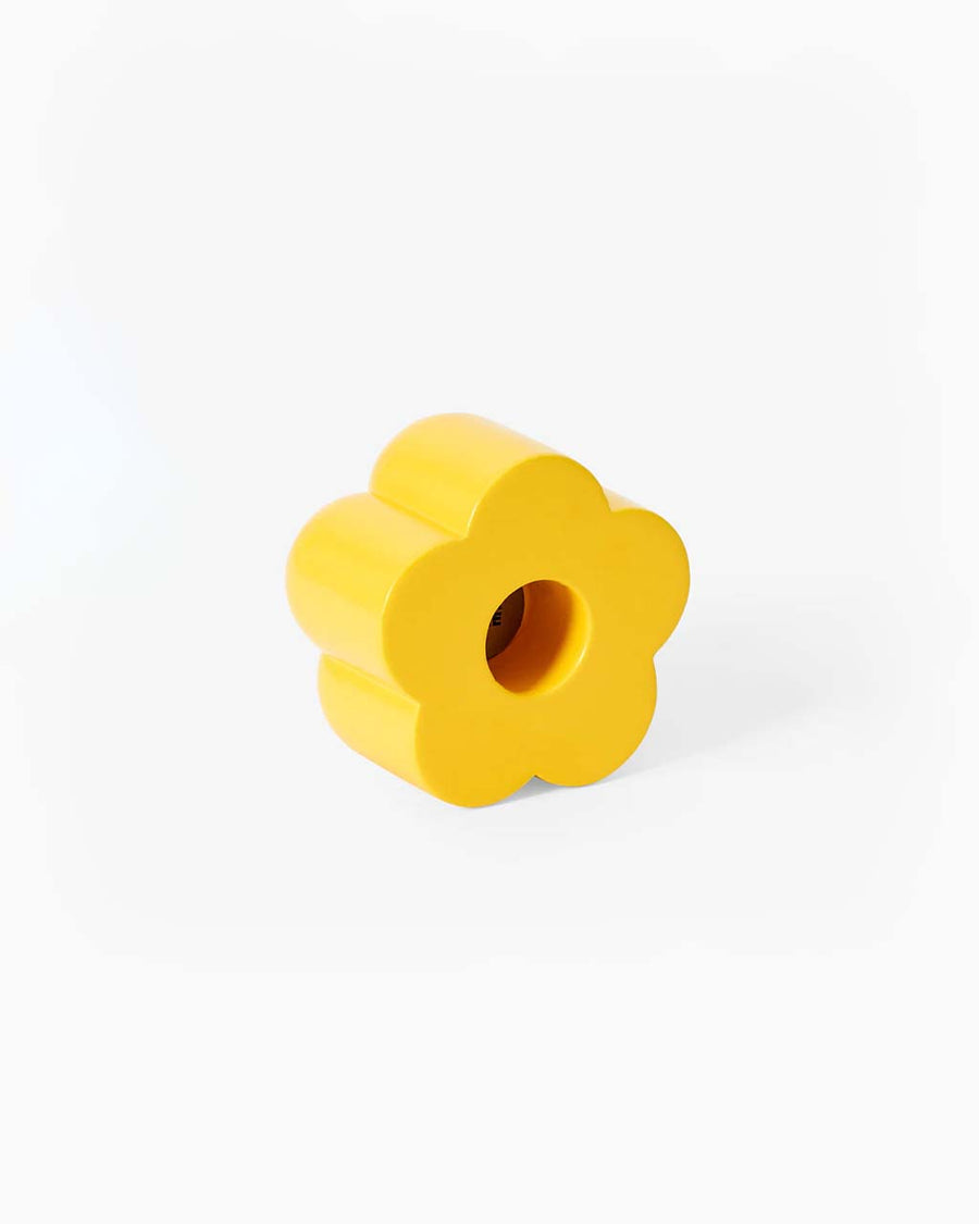 yellow flower shaped incense and candle holder