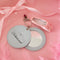 opened light blue leatherette mirror keychain with cursive 'delusional' across the front and with heart and ballet slipper charm