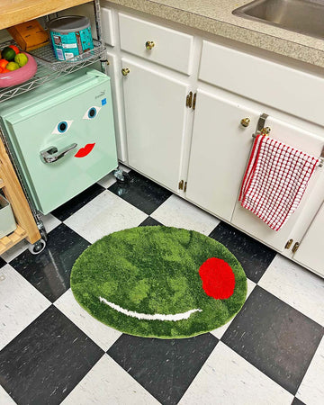 green olive shaped rug in kitchen