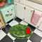 green olive shaped rug in kitchen