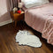 white persian cat throw rug in bedroom