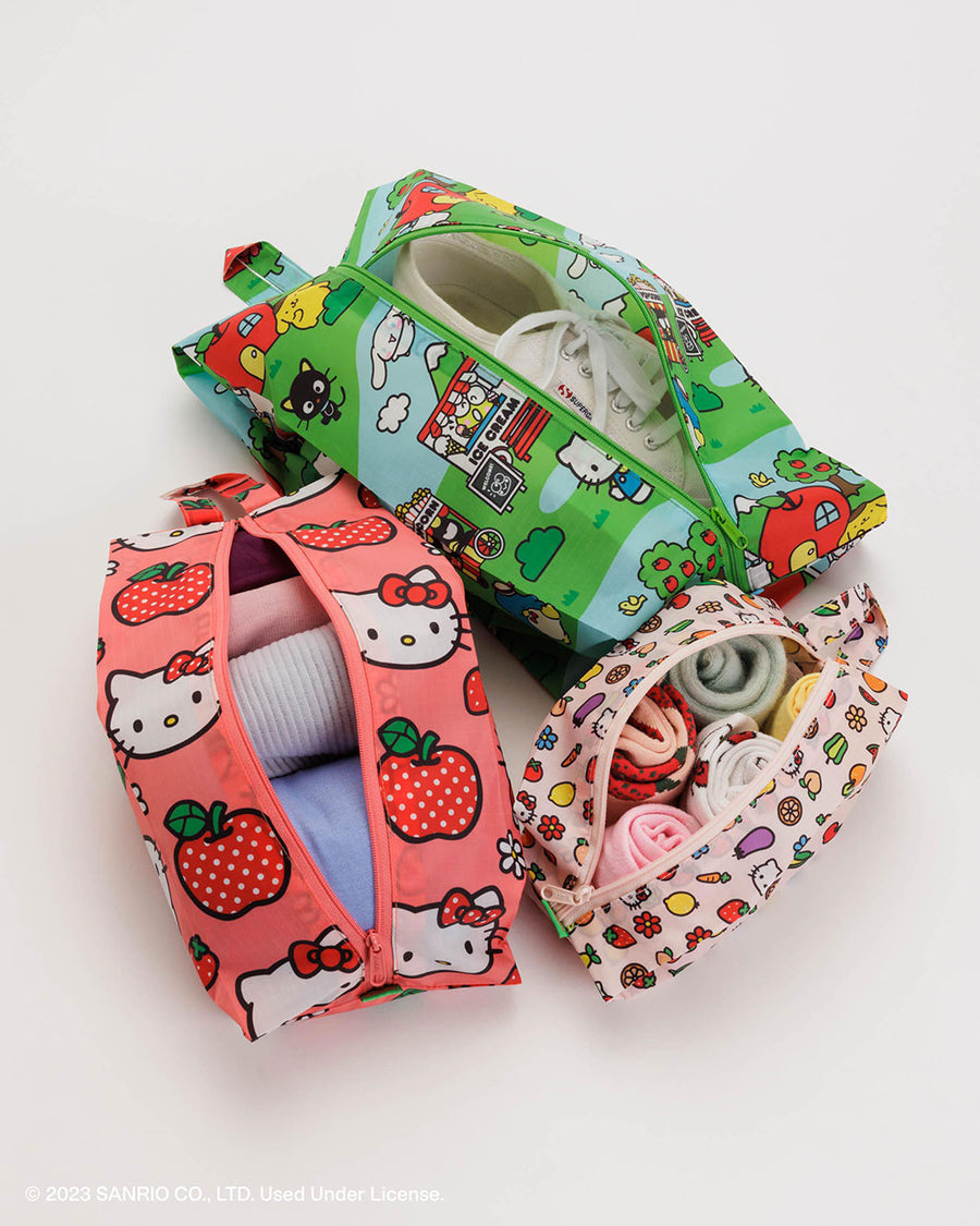 set of three 3d zip set: small hello kitty and fruit, medium pink hello kitty apple and large sanrio village scene filled with items
