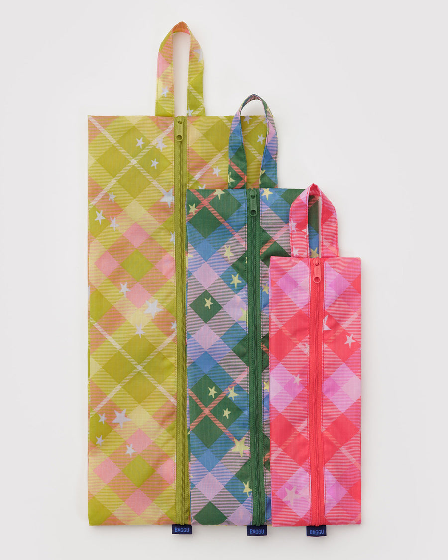 flattened set of 3 3d zip pouches: pink plaid star, green/blue plaid star, and yellow plaid star