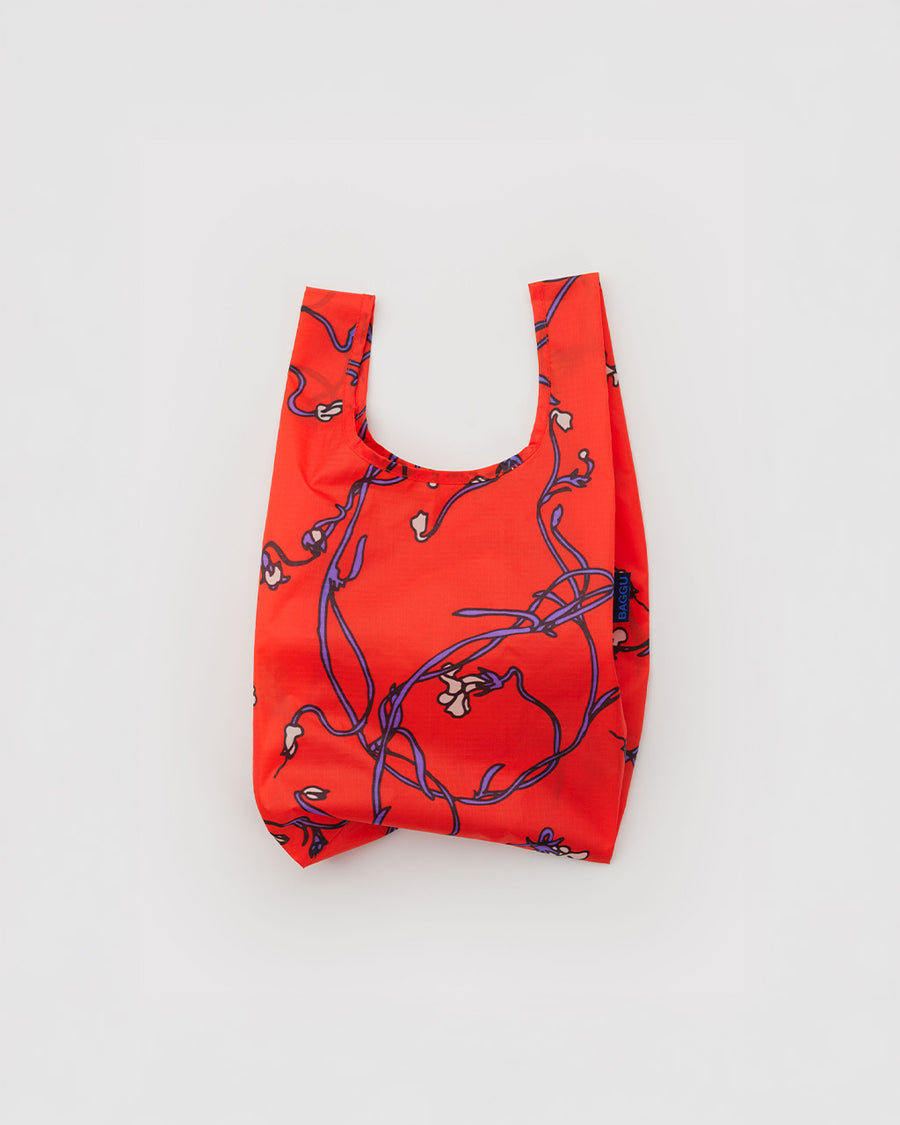 red baby baggu with purple snapdragon print
