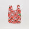 pink baby baggu with apple and hello kitty face print