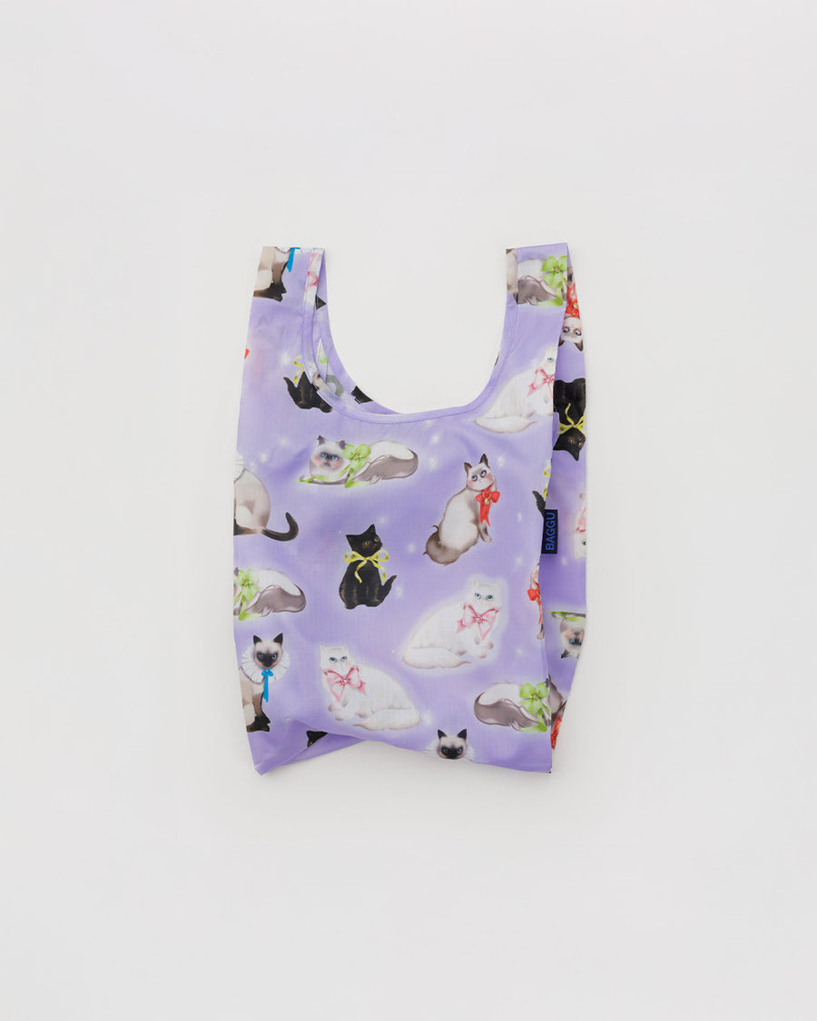 purple baby baggu with various cats with ribbons tied around their necks