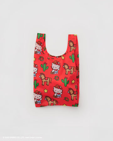 coral baby baggu with hello kitty dressed like a cowboy and has horse, cactus, lassos, and stars surrounding
