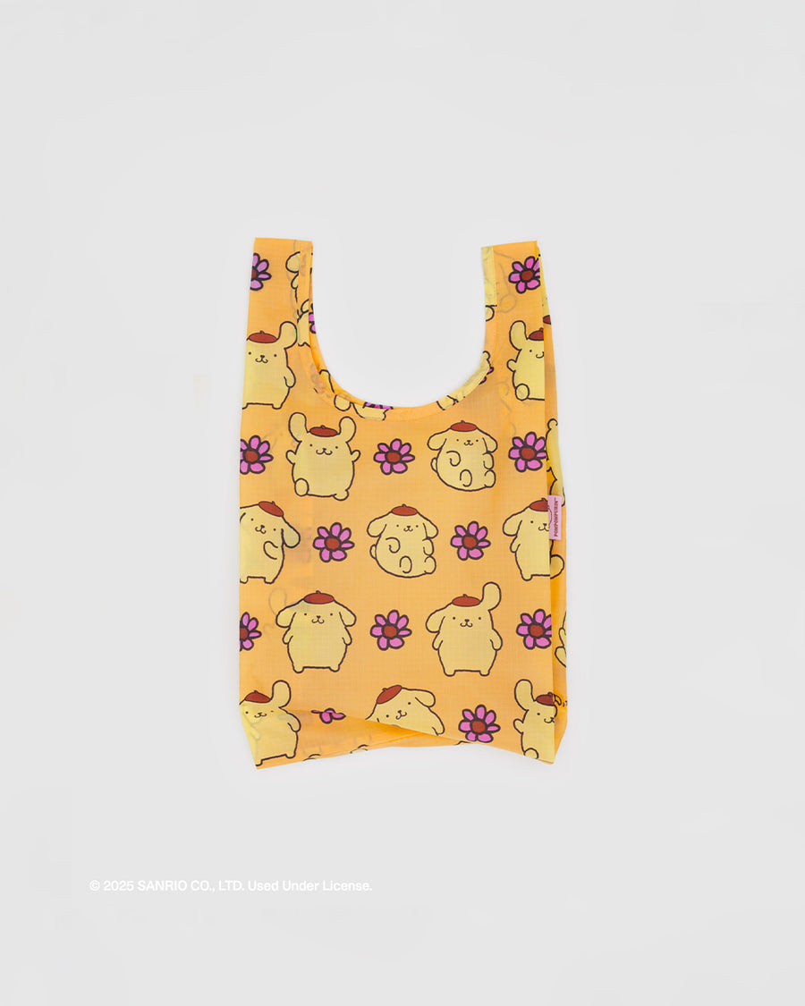 yellow baby baggu with pompompurin and pink flowers