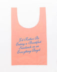 pink standard baggu that says 'i'd rather be eating a breakfast sandwich on an everything bagel' in blue cursive font