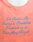 pink standard baggu that says 'i'd rather be eating a breakfast sandwich on an everything bagel' in blue cursive font