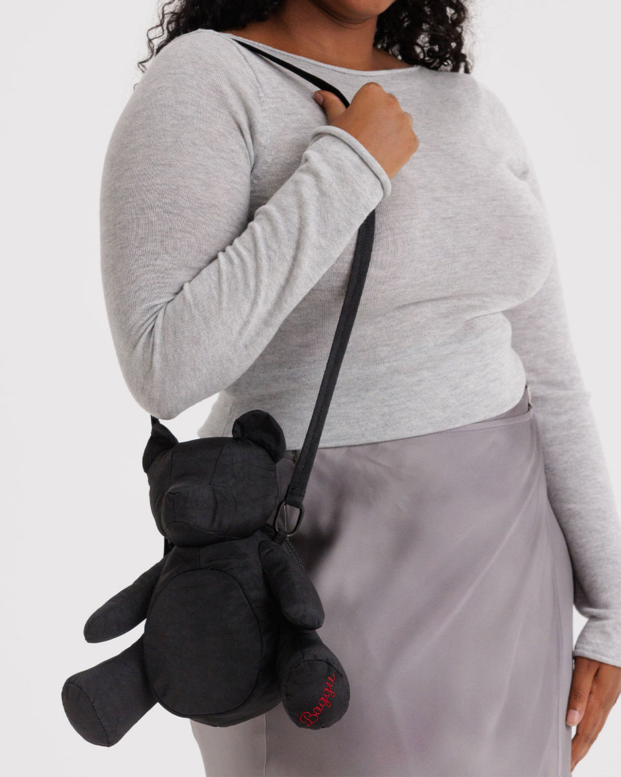 model wearing nylon plush black teddy bear crossbody purse