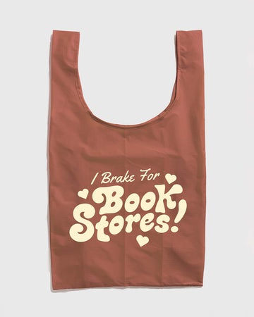 brown (terracotta) standard baggu with cream 'i brake for bookstores!' across the front