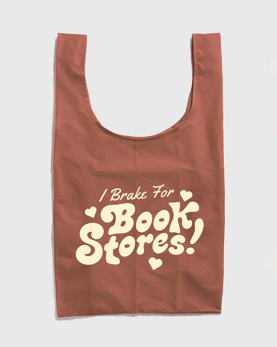 brown (terracotta) standard baggu with cream 'i brake for bookstores!' across the front