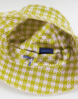 underside of pink and pistachio pixel gingham print bucket hat