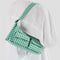 model wearing small green and white gingham cargo baguette bag